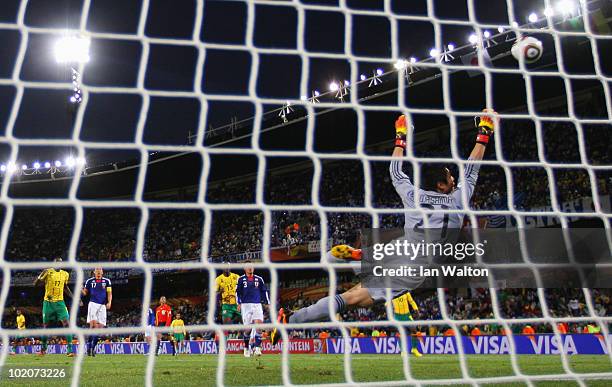 Eiji Kawashima of Japan dives to save a shot on goal during the 2010 FIFA World Cup South Africa Group E match between Japan and Cameroon at the Free...