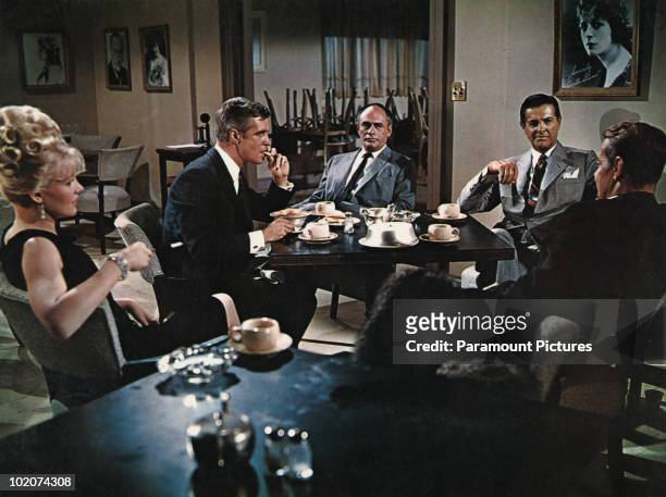 From left to right, Carroll Baker, George Peppard , Martin Balsam , Robert Cummings and Alan Ladd star in 'The Carpetbaggers', 1964.