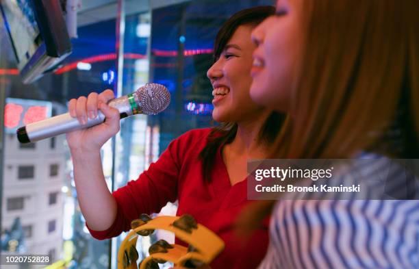 young women sing karaoke in tokyo - japanese culture on show at hyper japan stock pictures, royalty-free photos & images