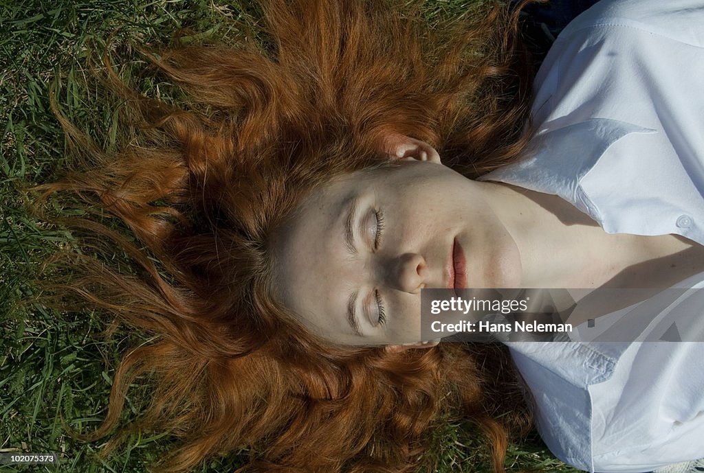High angle view of a woman lying on grass, Kiev, Ukraine