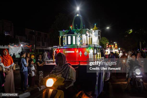 Indonesian Muslims parade on the streets as Muslims celebrate Eid Al-Adha in Mataram on August 21, 2018 in Lombok island, Indonesia. Thousands of...