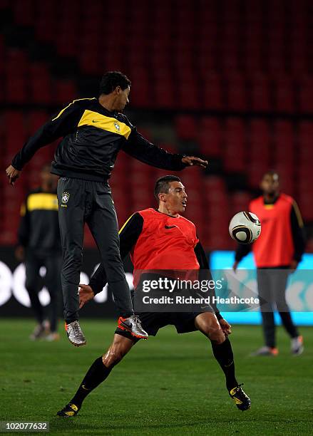 Kleberson and Lucio in action during the Brazil training session at Ellis Park on June 14, 2010 in Johannesburg, South Africa. Brazil will play their...