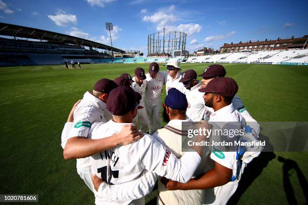 Surrey players huddle during day three of the Specsavers County Championship Division One match between Surrey and Lancashire at The Kia Oval on...