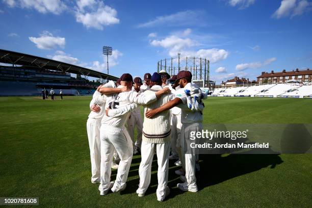 Surrey players huddle during day three of the Specsavers County Championship Division One match between Surrey and Lancashire at The Kia Oval on...