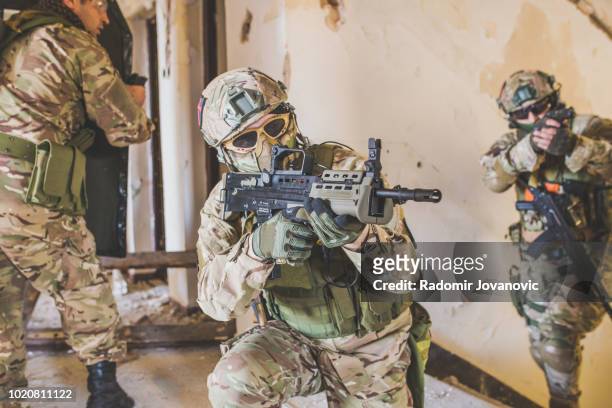 soldiers sneaking - combat sport stock pictures, royalty-free photos & images