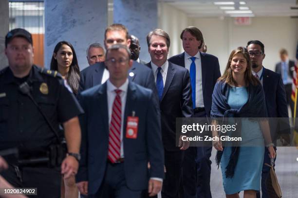 Supreme Court Nominee Brett Kavanaugh walks to a meeting with Sen. Claire McCaskill in her office on Capitol Hill on August 21, 2018 in Washington,...