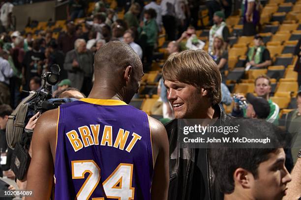 Finals: New England Patriots QB Tom Brady casual, shaking hands with Los Angeles Lakers Kobe Bryant after Game 3 vs Boston Celtics. Boston, MA...