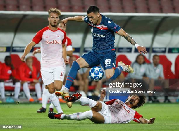 Nemanja Radonjic of Crvena Zvezda in against Andre Ramalho of Red Bull Salzburg during the UEFA Champions League Play Off First Leg match between FK...