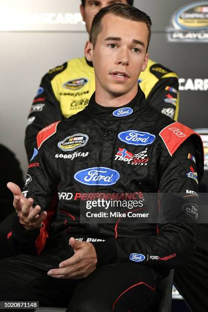 Ben Rhodes answers questions from the media assembled for the NASCAR Camping World Truck Series Production Media Day at FOX Sports Studios on August...