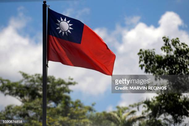 View of the Taiwan flag at the Embassy of Taiwan in San Salvador on August 21, 2018. - China and El Salvador established diplomatic relations Tuesday...
