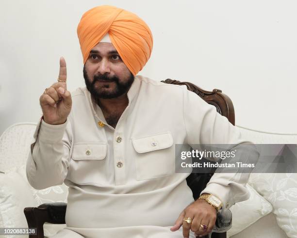 Punjab Cabinet Minister Navjot Singh Sidhu gestures during a press conference on August 21, 2018 in Chandigarh, India. Punjab Cabinet Minister Navjot...