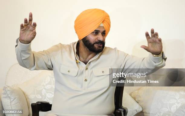 Punjab Cabinet Minister Navjot Singh Sidhu gestures during a press conference on August 21, 2018 in Chandigarh, India. Punjab Cabinet Minister Navjot...