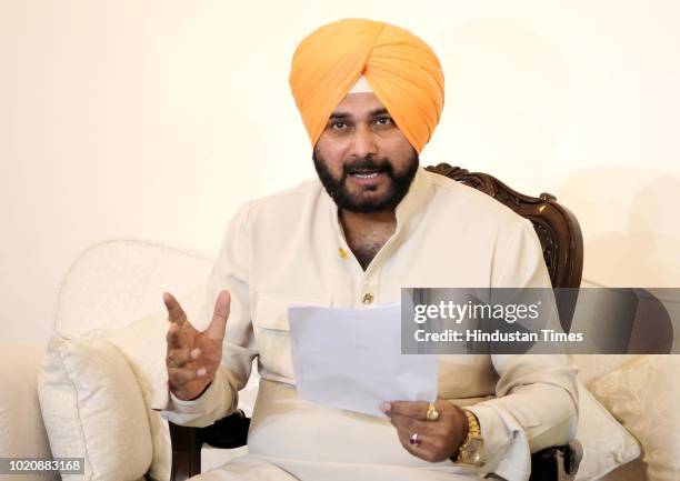 Punjab Cabinet Minister Navjot Singh Sidhu gestures during a press conference on August 21, 2018 in Chandigarh, India. Punjab Cabinet Minister Navjot...