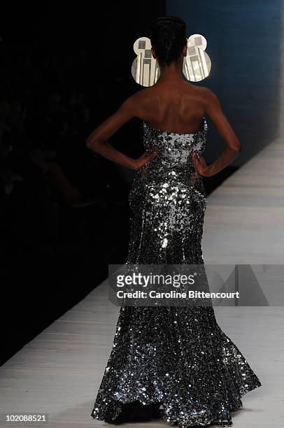 Model displays a design by Andre Lima during the sixth day of Sao Paulo Fashion Week Summer 2011 at Bienal pavilion on June 14, 2010 in Sao Paulo,...