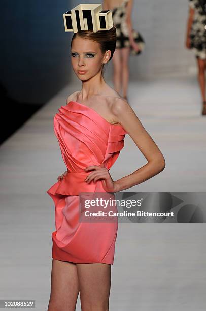 Model displays a design by Andre Lima during the sixth day of Sao Paulo Fashion Week Summer 2011 at Bienal pavilion on June 14, 2010 in Sao Paulo,...