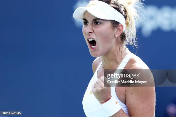 Belinda Bencic of Switzerland celebrates during a match against Camila Giorgi of Italy during Day 2 of the Connecticut Open at Connecticut Tennis...