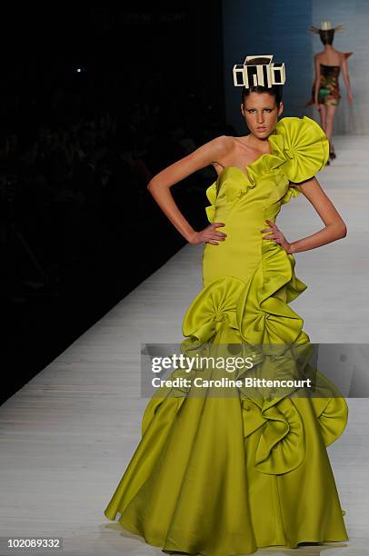 Model displays a design by Andre Lima during the sixth day of the Sao Paulo Fashion Week Summer 2011 at Bienal pavilion on June 14, 2010 in Sao...