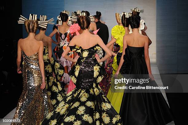 Models on the catwalk in the end of Andre Lima's fashion show during the sixth day of the Sao Paulo Fashion Week Summer 2011 at the Ibirapuera's...