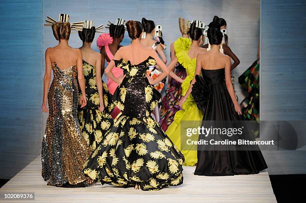 Models on the catwalk in the end of Andre Lima's fashion show during the sixth day of the Sao Paulo Fashion Week Summer 2011 at the Ibirapuera's...