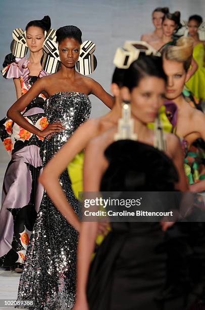 Models on the catwalk in the end of Andre Lima's fashion show during the sixth day of the Sao Paulo Fashion Week Summer 2011 at the Ibirapuera's...