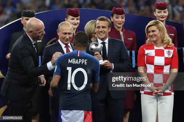 Gianni Infantino, Russia president Vladimir Putin Emmanuel Macron and Croatia president Kolinda Grabar-Kitarovic are seen as Kylian Mbappe of France...