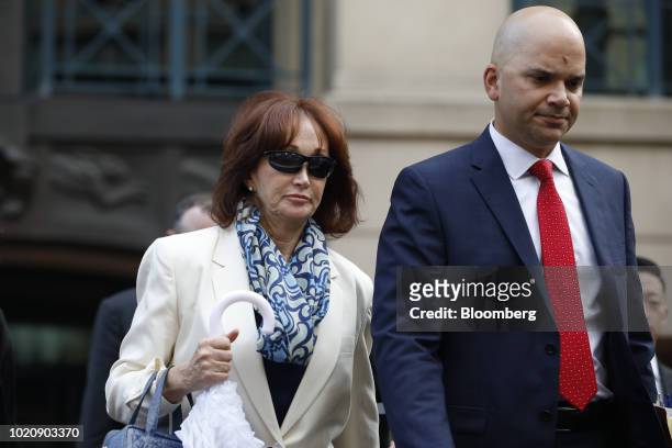 Kathleen Manafort, wife of former Donald Trump campaign manager Paul Manafort, left, and Jay Nanavati, co-counsel for Manafort, exit from District...