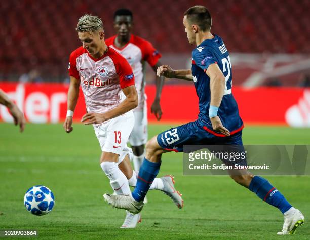 Hannes Wolf of Red Bull Salzburg in action against Milan Rodic of Crvena Zvezda during the UEFA Champions League Play Off First Leg match between FK...
