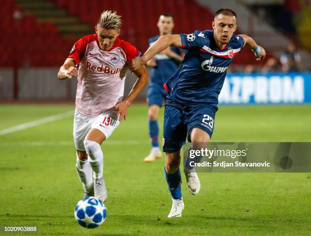 Hannes Wolf of Red Bull Salzburg in action against Milan Rodic of Crvena Zvezda during the UEFA Champions League Play Off First Leg match between FK...