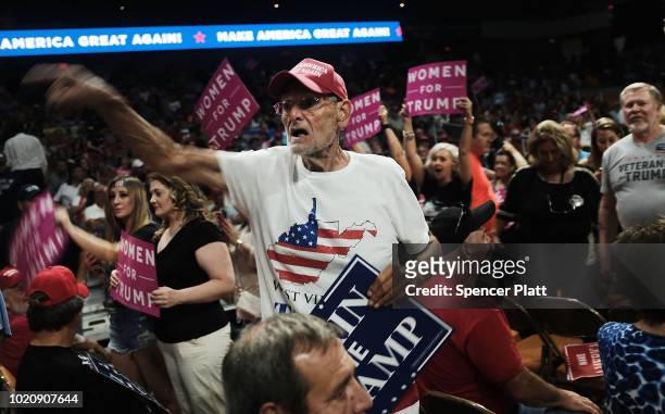 Supporters of President Donald Trump attend a rally for him on August 21, 2018 in Charleston, West Virginia. Paul Manafort, a former campaign manager...