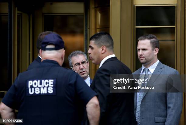 Police gather before Michael Cohen, former lawyer to U.S. President Donald Trump, exits the Federal Courthouse on August 21, 2018 in New York City....