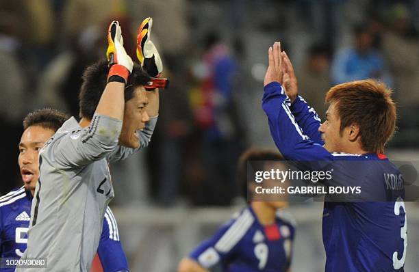 Japan's goalkeeper Eiji Kawashima and Japan's defender Yuichi Komano celebrate after their Group E first round 2010 World Cup football match on June...