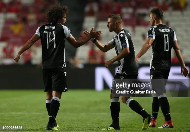 Amr Warda of PAOK celebrates with teammate Dimitris Peleas of PAOK after scoring a goal during the UEFA Champions League Play Off match between SL...