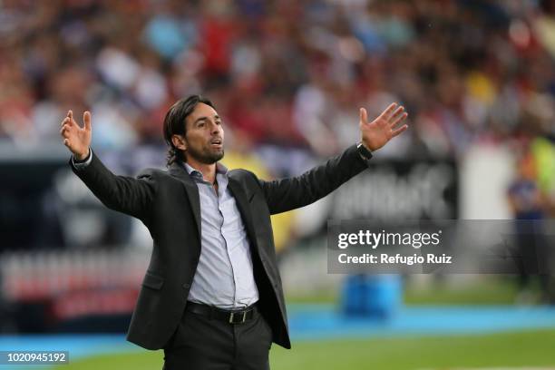 Gerardo Espinoza coach of Atlas gives instructions to his players during the fifth round match between Atlas and Morelia as part of the Torneo...