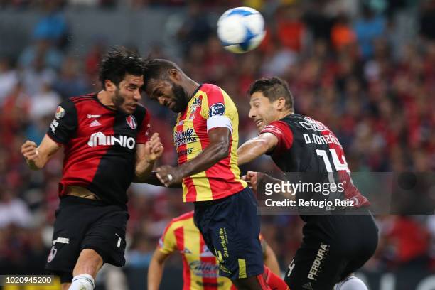 Juan Vigon of Atlas fights for the ball with Gabriel Achilier of Morelia during the fifth round match between Atlas and Morelia as part of the Torneo...