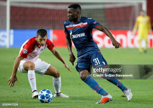 El Fardou Ben Nabouhane of Crvena Zvezda in action against Stefan Lainer of Red Bull Salzburg during the UEFA Champions League Play Off First Leg...