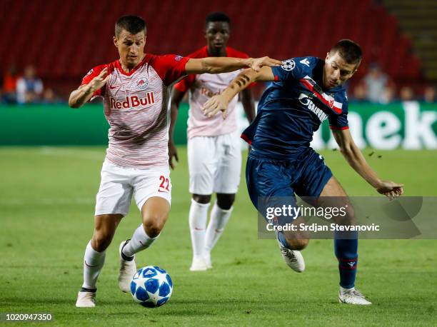 Stefan Lainer of Red Bull Salzburg in action against Dusan Jovancic of Crvena Zvezda during the UEFA Champions League Play Off First Leg match...