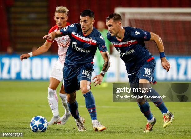 Nemanja Radonjic and Nikola Stojiljkovic of Crvena Zvezda in action during the UEFA Champions League Play Off First Leg match between FK Crvema...