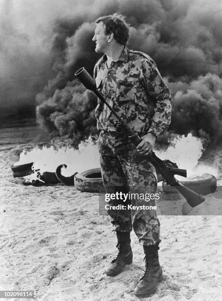 South African soldier holding a tear gas grenade launcher during rioting near Cape Town, South Africa, 15th September 1976. The unrest comes in the...