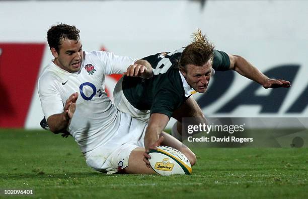 Lachie Turner of the Australian Barbarians beats Olly Barkley to the ball during the match between the Australian Barbarians and England at on June...