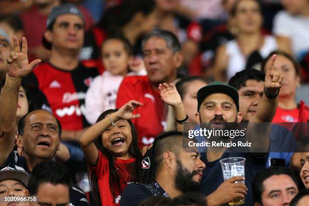 Fans of Atlas their team in the stands during the fifth round match between Atlas and Morelia as part of the Torneo Apertura 2018 Liga MX at Jalisco...