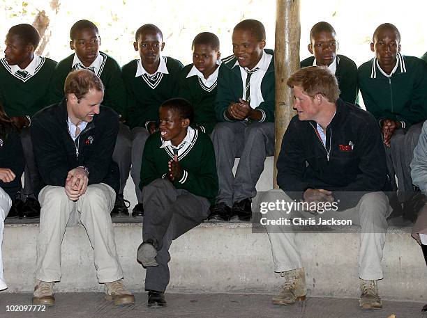 Prince Harry and Prince William talk to children as they visit the Mokolodi Education Centre on June 15, 2010 in Gaborone, Botswana. The two Princes...