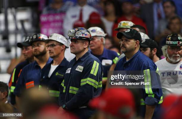 Coal miners listen as President Donald Trump speaks at a rally on August 21, 2018 in Charleston, West Virginia. Paul Manafort, a former campaign...