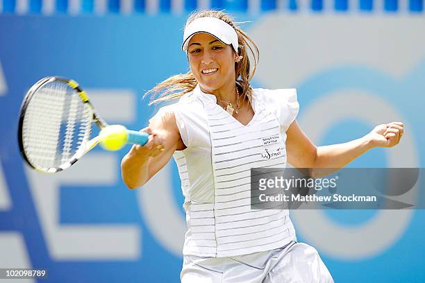 Aravane Rezai of France returns a shot to Caroline Wozniacki of Denmark during the AEGON International at Devonshire Park on June 15, 2010 in...