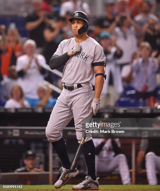 Giancarlo Stanton of the New York Yankees gets a standing ovation before his first at bat in the first inning against the Miami Marlins at Marlins...