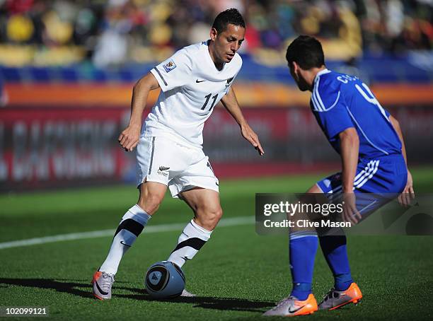 Leo Bertos of New Zealand attempts to past Marek Cech of Slovakia during the 2010 FIFA World Cup South Africa Group F match between New Zealand and...