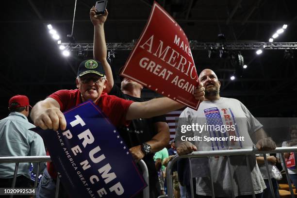 Supporters of President Donald Trump jeer at the media during a rally on August 21, 2018 in Charleston, West Virginia. Paul Manafort, a former...