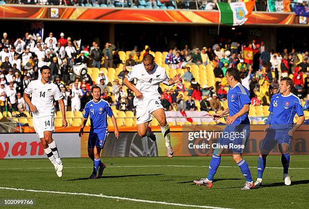 Winston Reid of New Zealand scores the first goal for his team during the 2010 FIFA World Cup South Africa Group F match between New Zealand and...