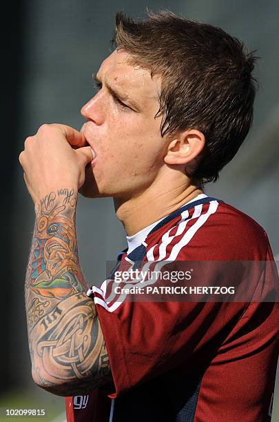 Denmark's defender Daniel Agger eats some fruit during a training session at Loerie Park in Knysna, in southern South Africa, on June 07, 2010 ahead...