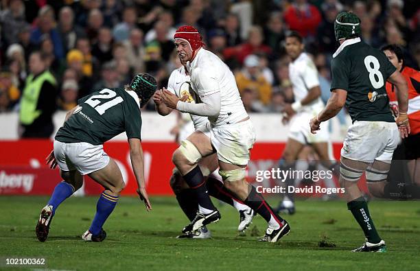 Dave Attwood of England takes on Berrick Barnes during the match between the Australian Barbarians and England at on June 15, 2010 in Gosford,...