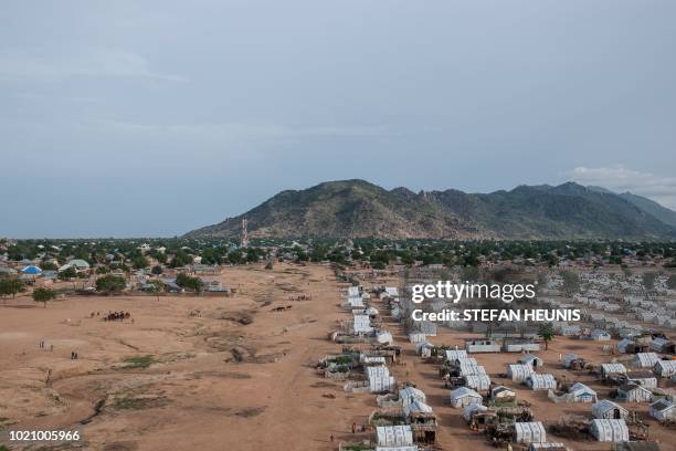 An aerial view shows the Mandara mountains and the town of Pulka with one of its five IDP camps on August 1, 2018. - As the presidential race heats...